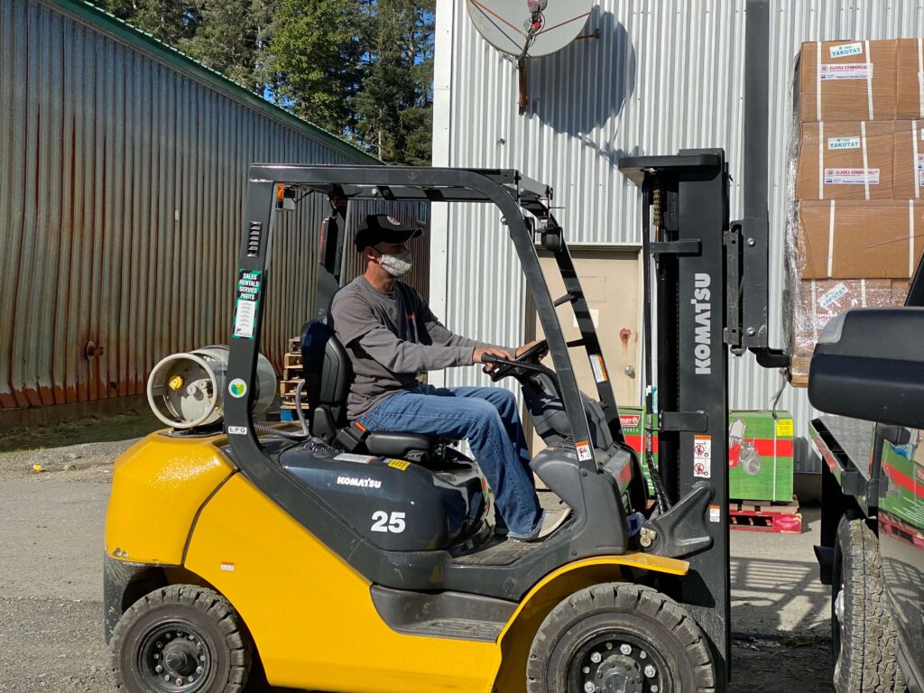 AC Yakutat Manager loading food boxes